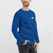 Model wearing the True ROyal GPW Long Sleeve Tee paired with jeans in a Studio Background.