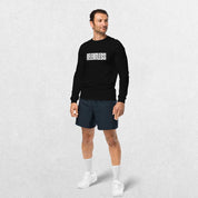 Model wearing Black long sleeve tee with jeans.