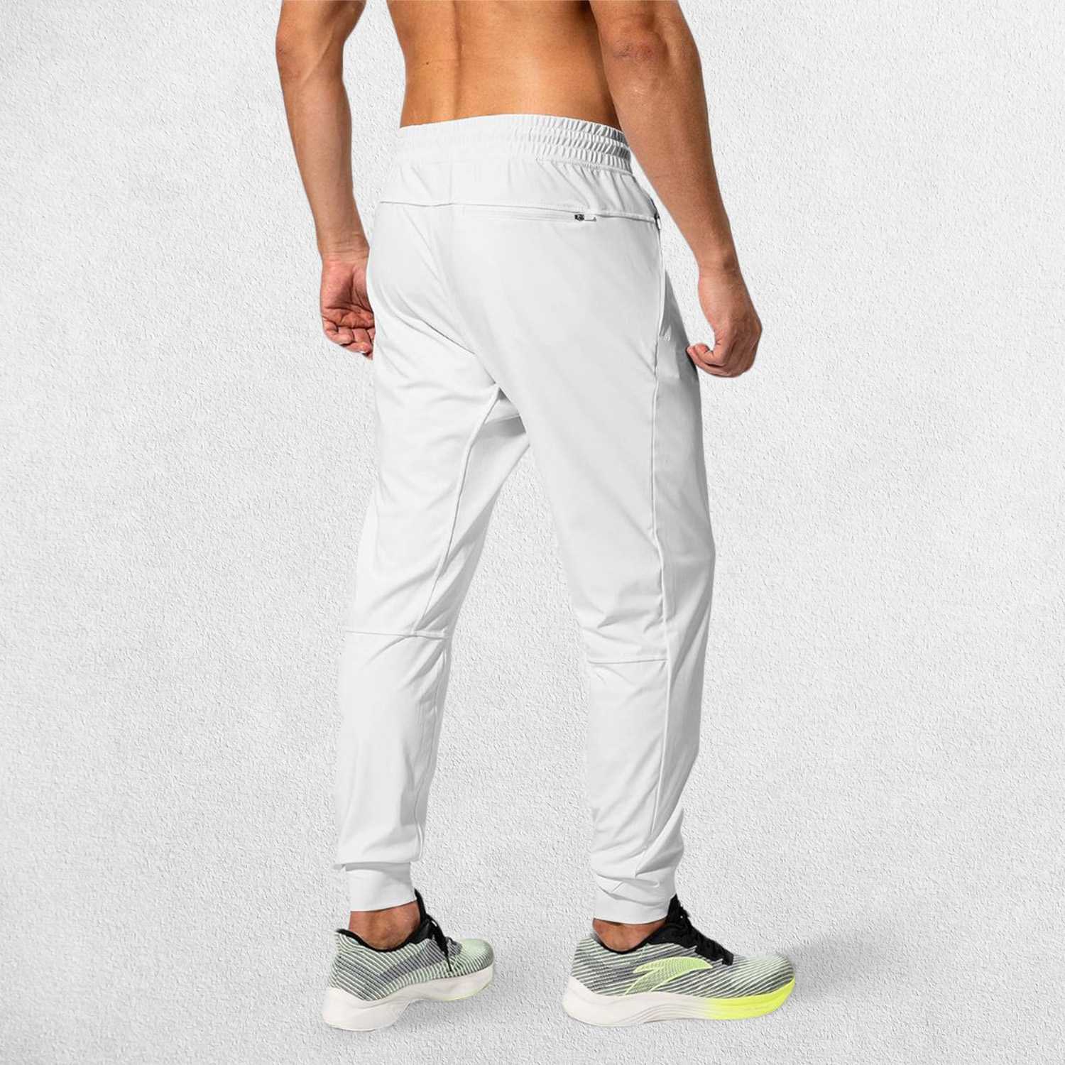 Rear view of White GPW Men's Sweatpants showcasing their flexible and comfortable fit.