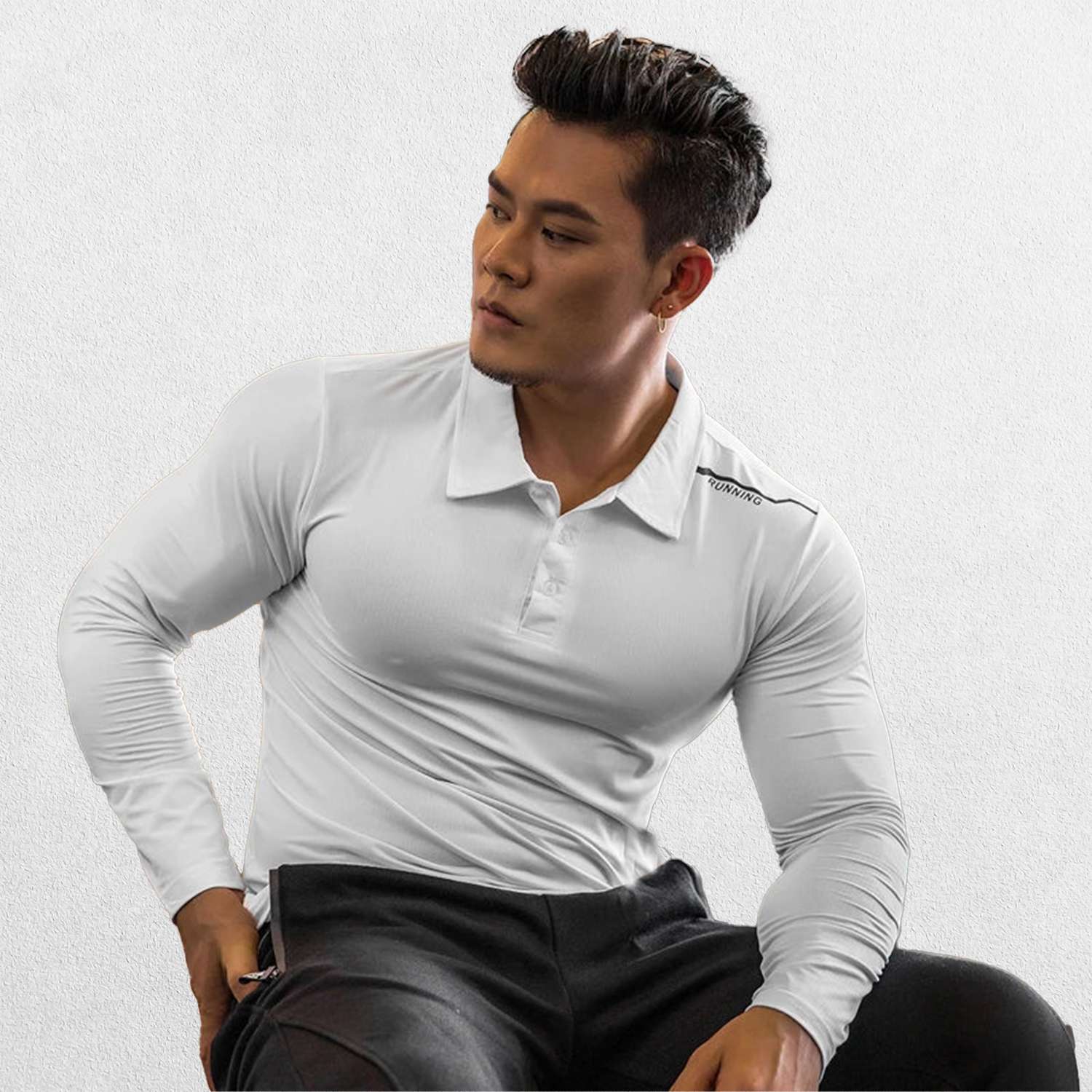 Close-up of White GPW Men's Compression Shirt - Long Sleeve Rashguard for Fitness in a studio background