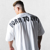 Model wearing White GPW Oversized T-Shirt, styled for streetwear and gym.