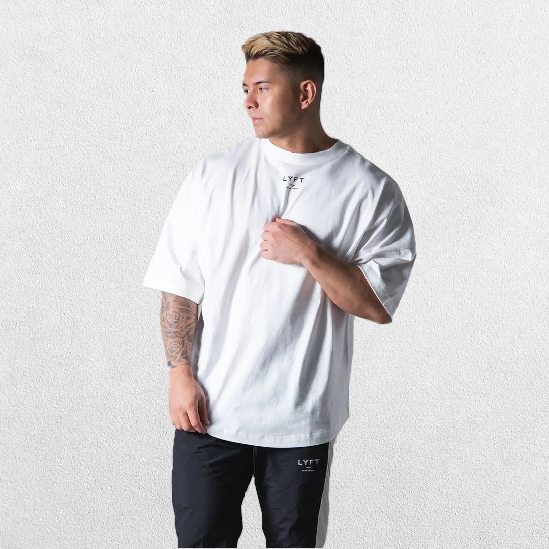 Model wearing White GPW Oversized T-Shirt, styled for streetwear and gym.