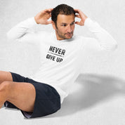 Exercising Model wearing the White GPW Never Give Up Performance Long Sleeve Tee with jeans in a studio background.