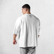 Back View of Model Wearing White Men's Casual Loose Oversized Cotton Printed T-shirt – Breathable & Stylish Workout Tee