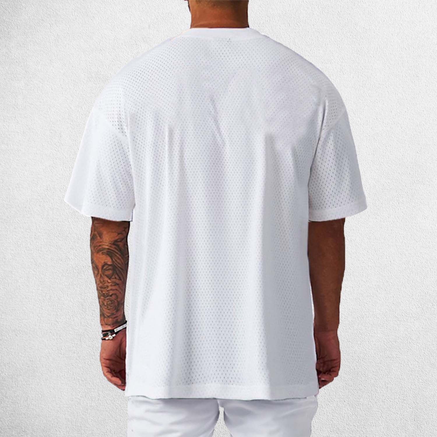 Back View of Model Wearing White Men's Oversized Gym T-Shirt – Breathable, Quick-Drying & Lightweight Training Tee