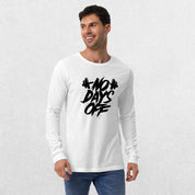 Model wearing the White No Days Off Unisex Long Sleeve Tee - Versatile Athletic and Casual Wear with jeans in studio background