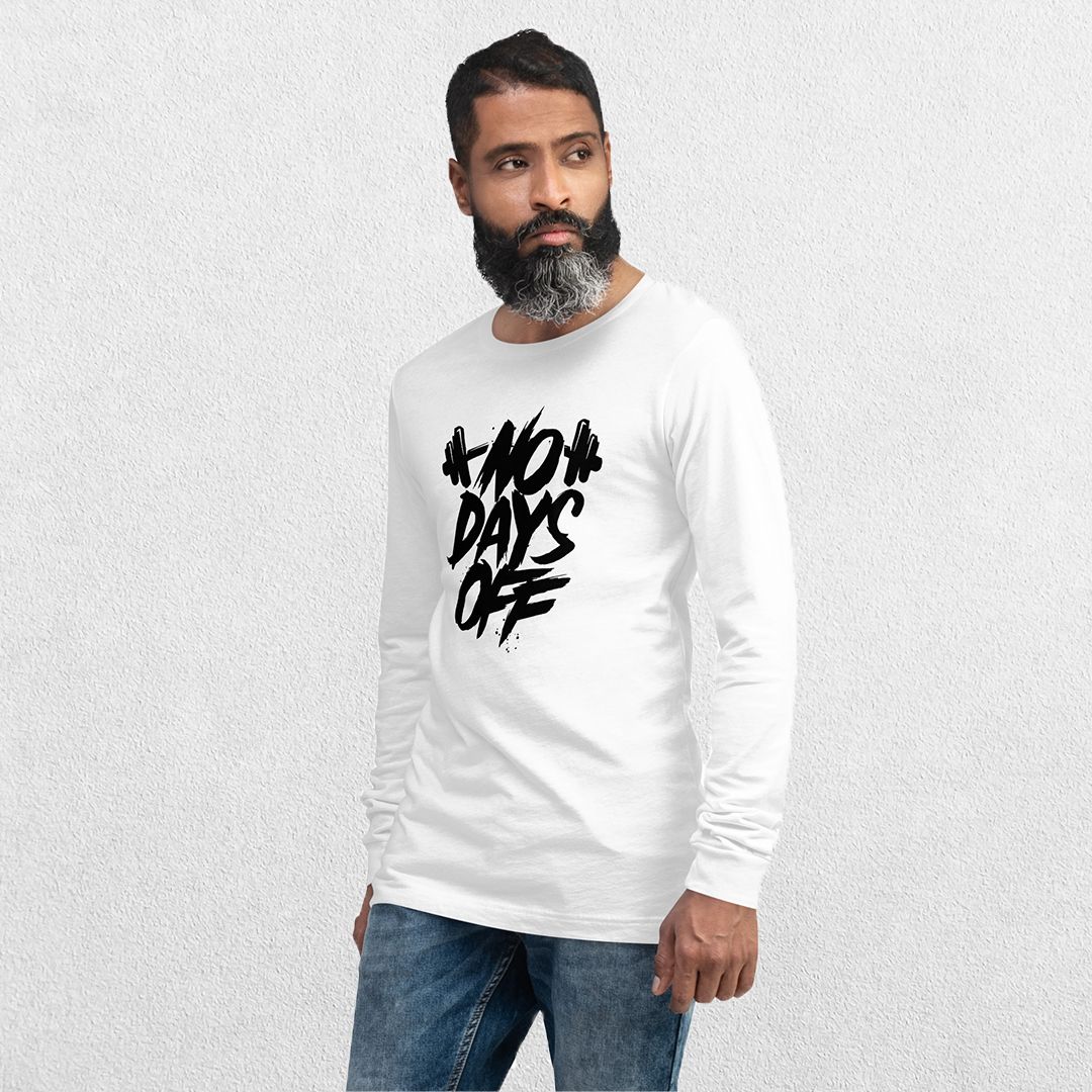 Model wearing the White No Days Off Unisex Long Sleeve Tee - Versatile Athletic and Casual Wear with jeans in studio background