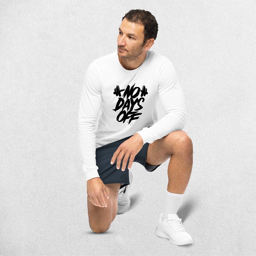 Sitting Model wearing the White No Days Off Unisex Long Sleeve Tee - Versatile Athletic and Casual Wear in studio background