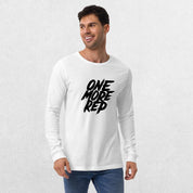 Model wearing the White One More Rep High-Performance Long Sleeve Tee – Unisex Gym Wear with jeans in a studio background.