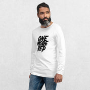 Model wearing the White One More Rep High-Performance Long Sleeve Tee – Unisex Gym Wear with jeans in a studio background.