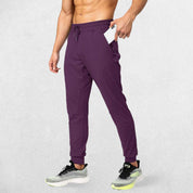 Wine Red GPW Men's Athletic Sweatpants featuring zipper pockets, athletic fit, and sleek design.
