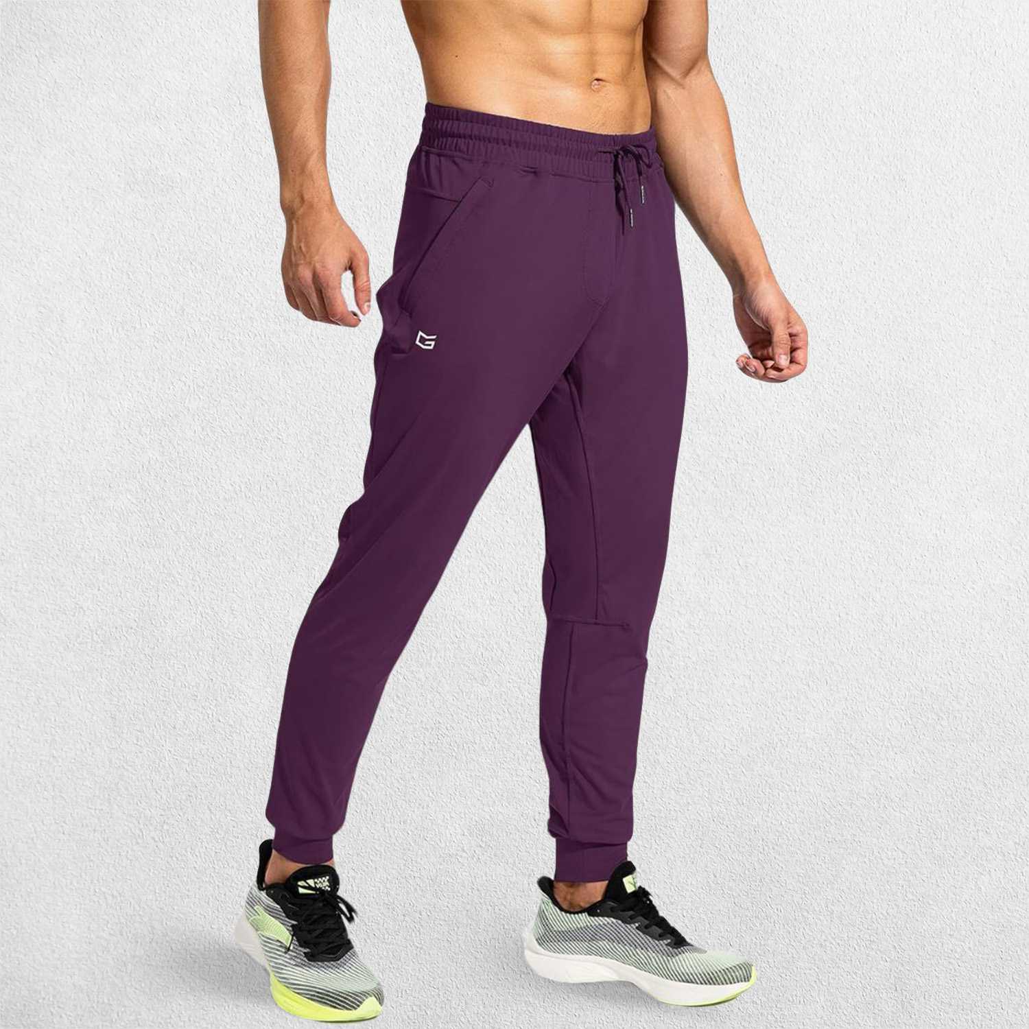 Side view of Wine Red GPW Men's Sweatpants showcasing their flexible and comfortable fit.
