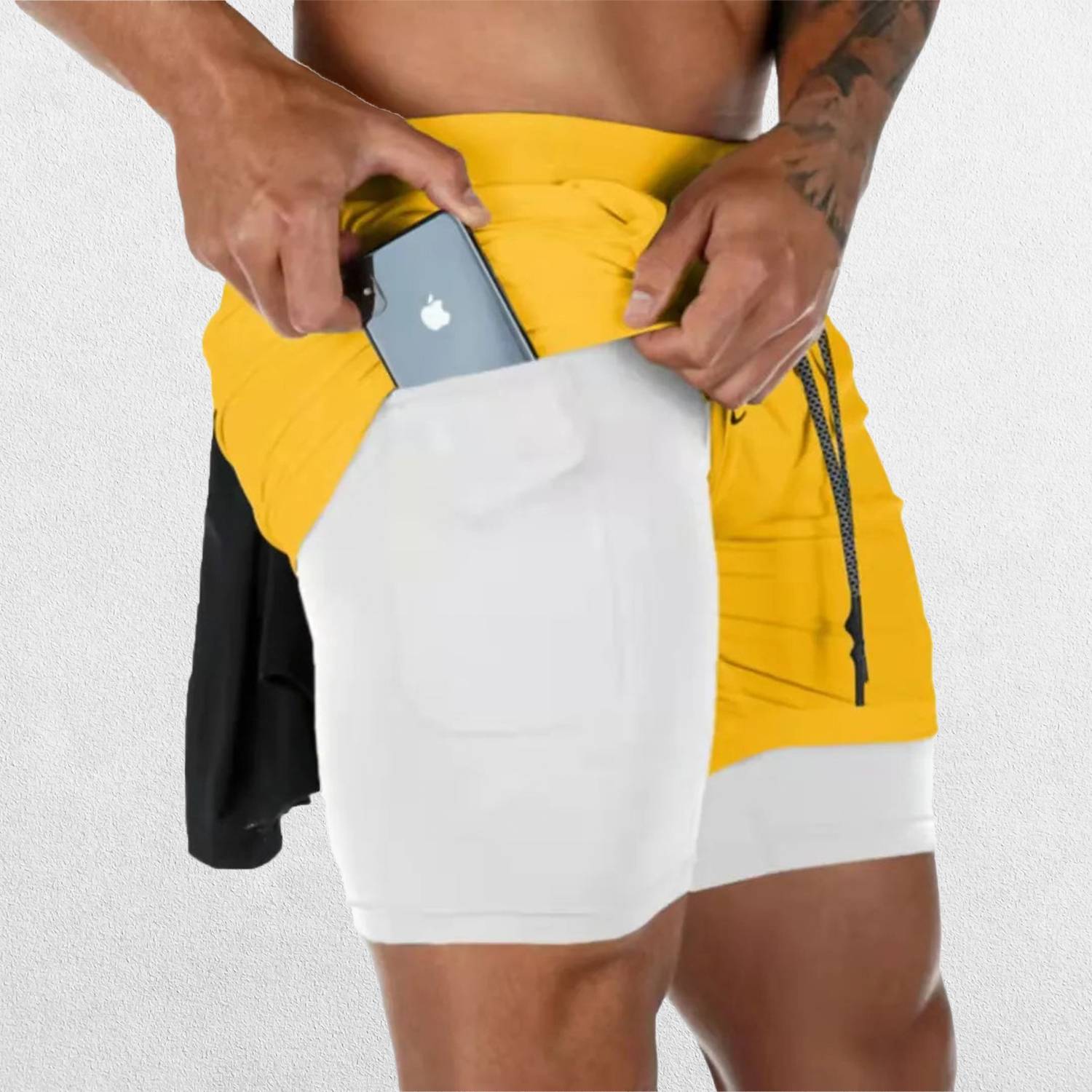 Side Pose of  Model wearing Yellow GPW Men's 2-in-1 Running Shorts for Gym & Fitness Workouts