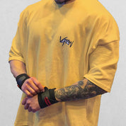 Close-up of Yellow GPW Men's Oversized T-Shirt - Casual Gym Bodybuilding Top