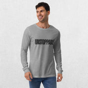 Model wearing the Athletic heather GPW Unisex Long Sleeve Tee with Unstoppable Design with jeans.