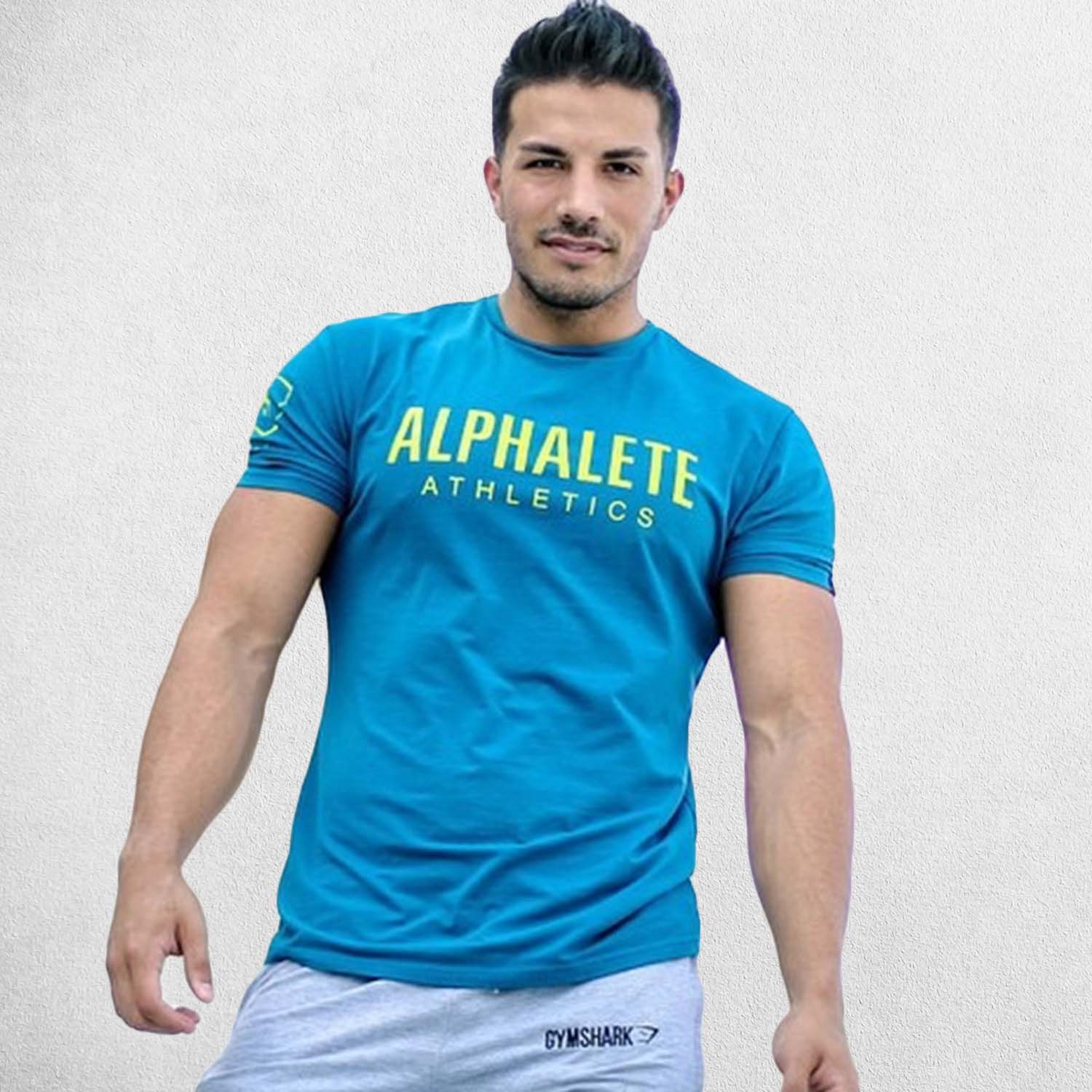 Model wearing BLue Gold Men’s Muscle Slim Fit Cotton Stretch T-Shirt for Gym, Workout & Casual Wear