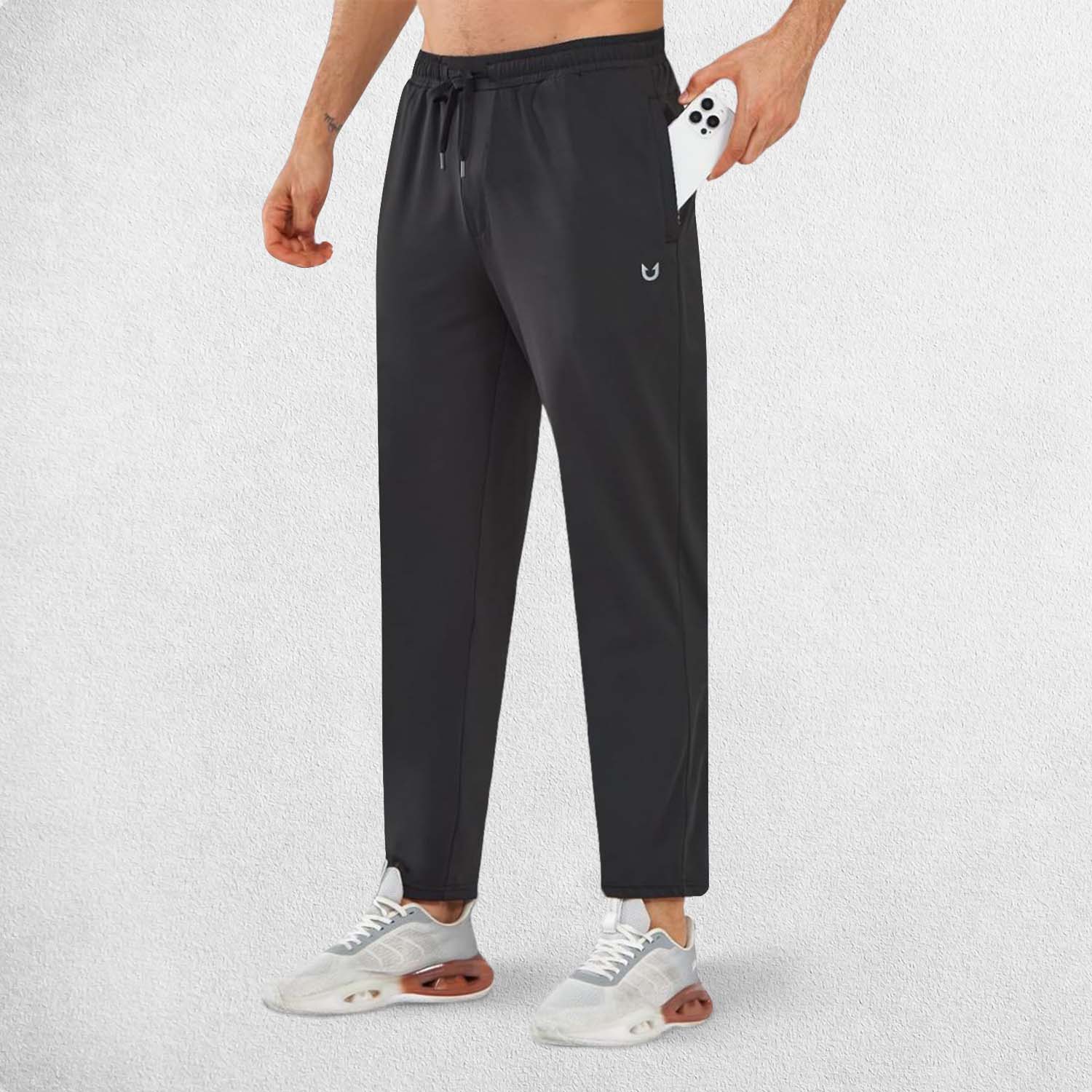 Side view of Model Wearing Black GPW Men’s Joggers with zipper pockets storing essentials.