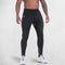 A man wearing GPW slim fit Black GPW Men's Slim Fit Trousers with Zipper Pockets for Training