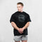 Black Loose Fit Barbell Club Tee - Oversized gym shirt front view.