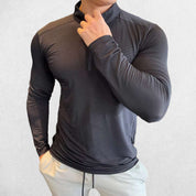 Front Pose of Model wearing Black Men's Activewear Sweat-Wicking High Collar Compression Top with Long Sleeves