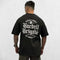 Back view of Model Wearing Black Men’s Barbell Brigade Cotton Workout Tee with bold print