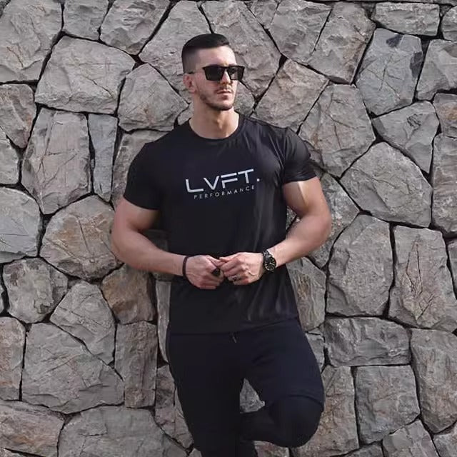 Model wearing Black Men’s Quick-Dry Running T-Shirt – Breathable & Lightweight Sportswear for Fitness & Training