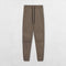 Full-length shot of Brown pants styled for both gym and casual wear.