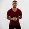 Front view of model wearing Burgundy Men’s V-Neck Slim Fit Gym T-Shirt – Breathable, Muscle-Enhancing Cotton Tee for Training & Casual Wear