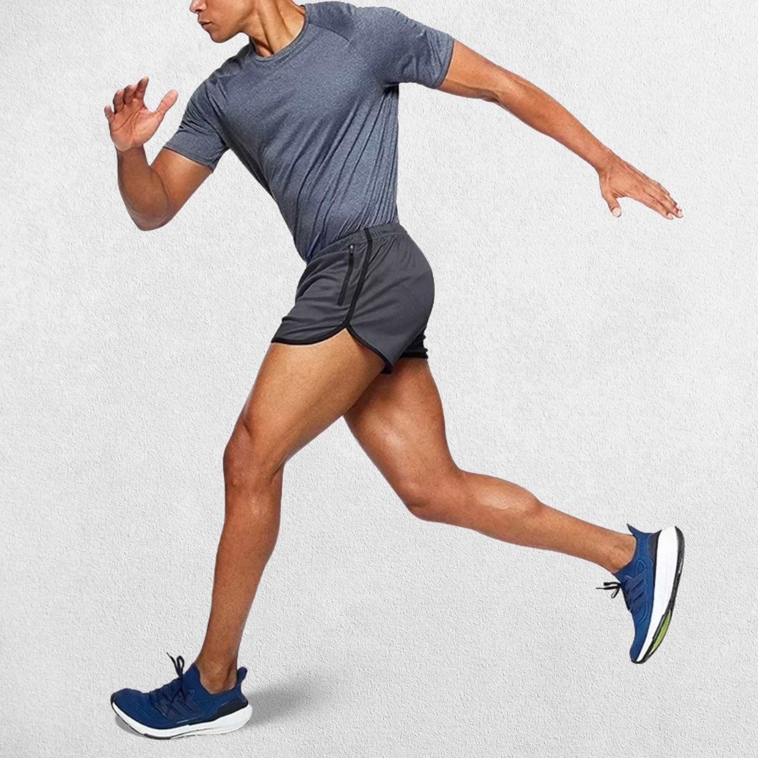 Running Model Wearing Dark Grey GPW Men’s Running Shorts showing its streching ability