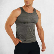 Front View of Model Wearing Dark Grey Men’s Sleeveless Breathable & Slim Fit Cotton Tank Top – Gym, Fitness, Casual Wear & Sports Undershirt