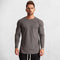 Model Wearing Dark Grey Men’s Slim Fit Cotton Fitness Long Sleeve T-Shirt – Front view showcasing O-neck design and letter pattern for casual and gym wear.