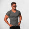 Model Wearing Dark Grey Men’s Summer Sports Fitness V-Neck Quick-Drying Breathable Striped T-Shirt with Floral Pattern in a studio background