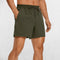 Front Close-up of Dark Olive Green GPW Men's Lightweight Quick-Dry Workout Shorts with Pockets in a studio background