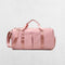 Pink GPW Gym Bag with external quick-access pockets.