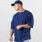 Casual styling of a Dark Blue men’s gym shirt in studio background