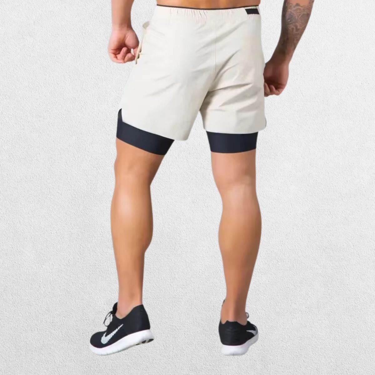  GPW Men's Double-Layered Gym Training Shorts in beige, back view featuring durable stitching and ergonomic fit.