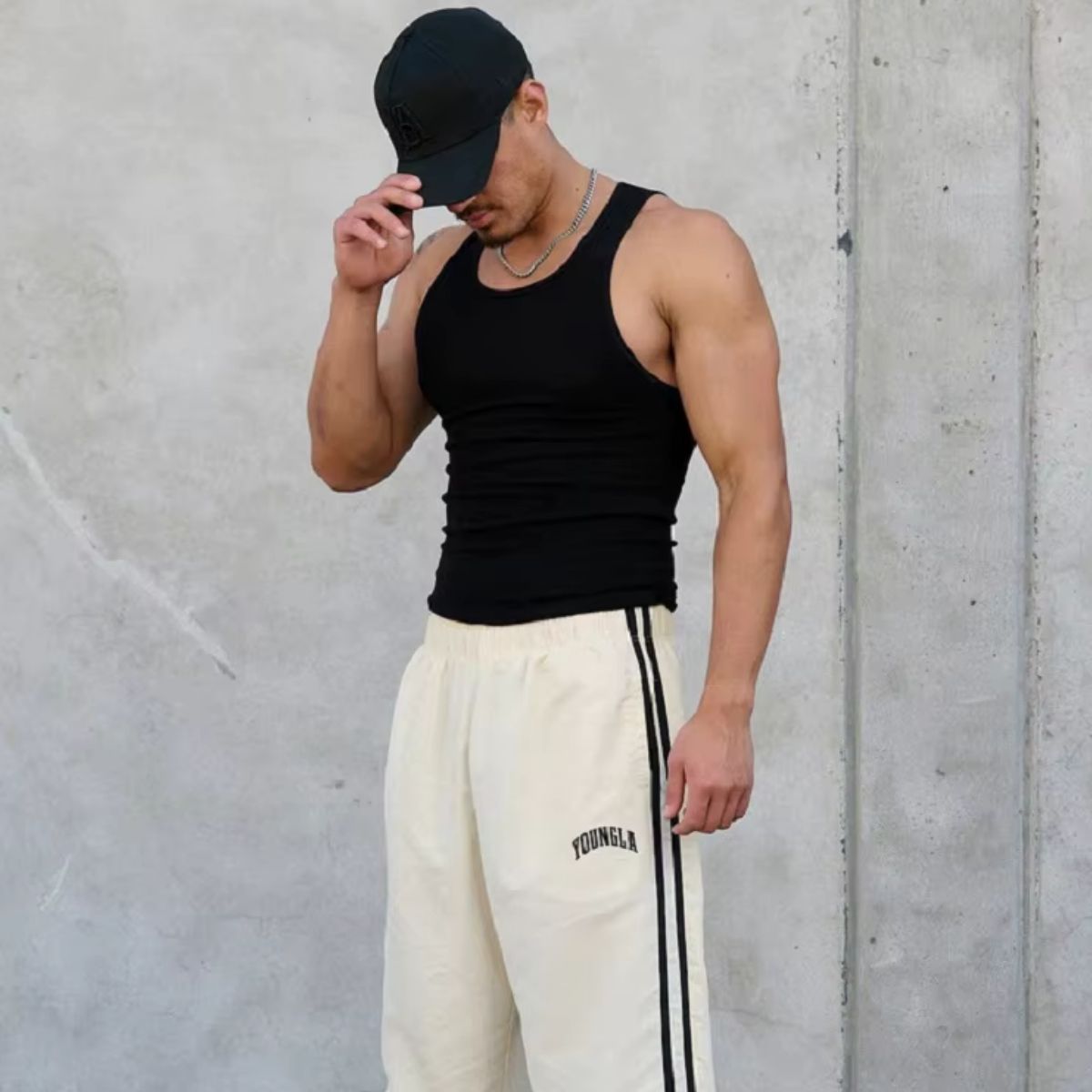 Model wearing  Pants in white, showcasing a sleek fit and versatile design for workouts or casual outings.