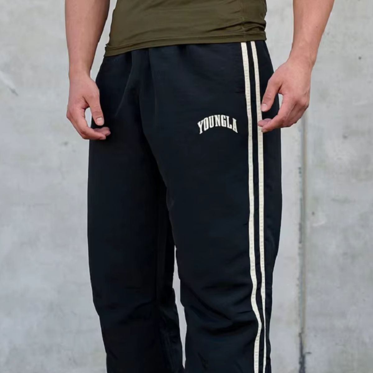 Model showcasing GPW Men’s Sports Pants in navy blue, highlighting their comfortable fit and athletic design.