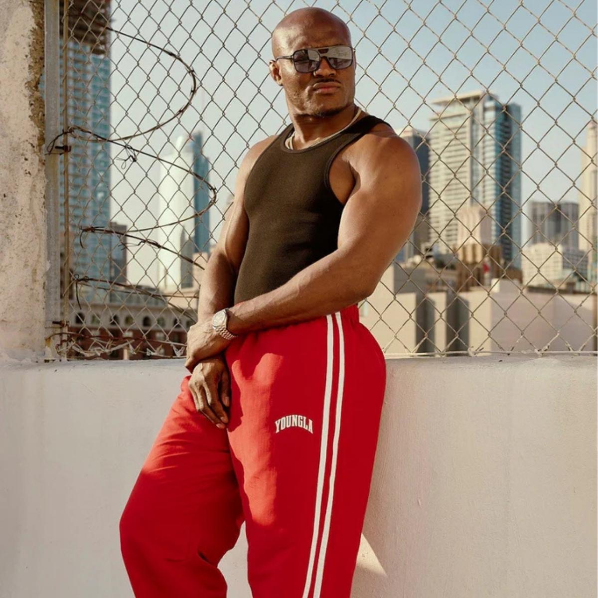 Model wearing red GPW Men’s Sports Pants, showcasing the athletic fit and modern style.