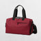 Red Stylish gym bag in a studio setting.