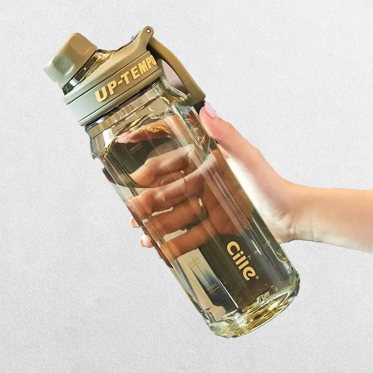 A person holding Green High-Quality Tritan Water Bottle with Built-In Filter for Gym & Outdoors