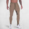 Front view of model wearing Khaki GPW Men's Slim Fit Trousers with Zipper Pockets for Training