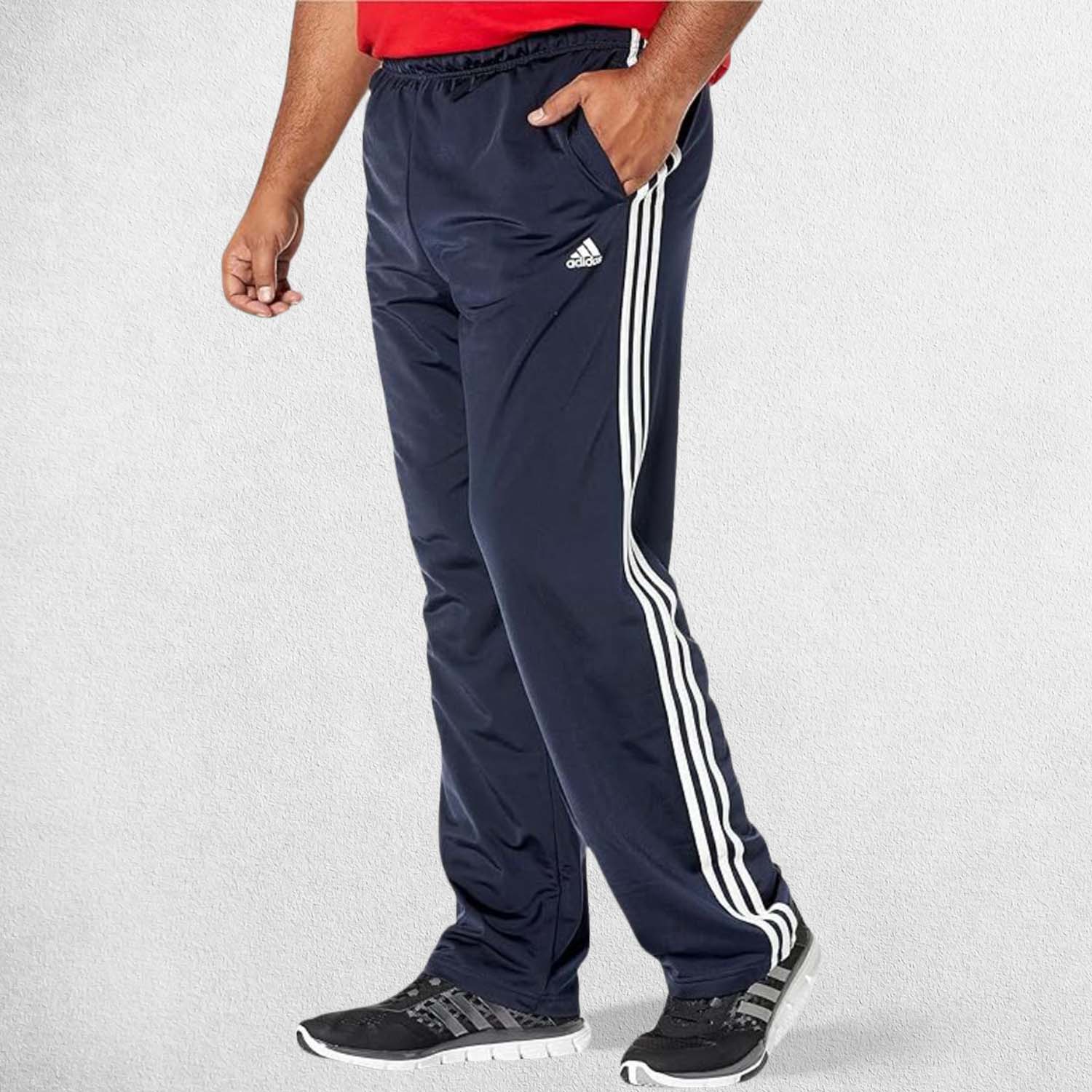 Side Pose of Model Wearing Legend ink 3-Stripes Tracksuit Pants made with Primegreen fabric