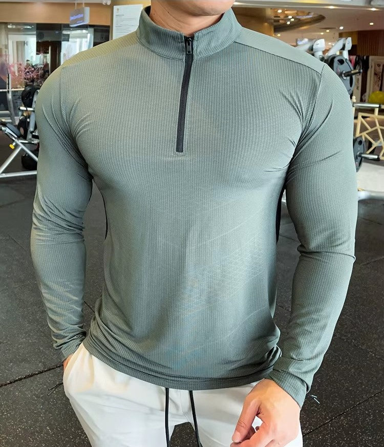 Front Pose of Model wearing Light Green Men's Activewear Sweat-Wicking High Collar Compression Top in gym background