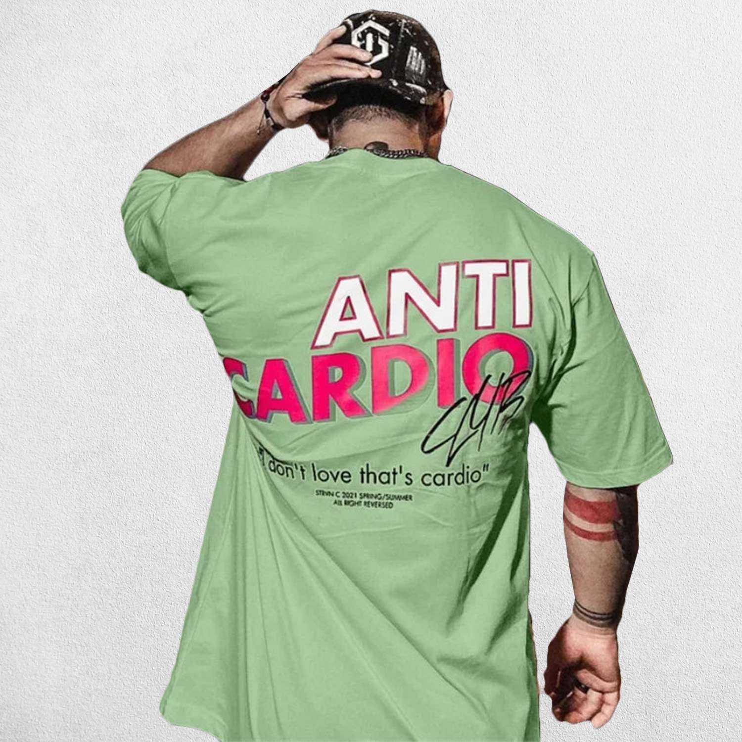 Model wearing Light Green Anti Cardio Oversized T-Shirt paired for casual athleisure look.
