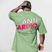 Model wearing Light Green Anti Cardio Oversized T-Shirt paired for casual athleisure look.

