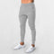 Model Wearing Light Grey GPW Men's Quick-Drying Lightweight Workout Running and Gym Trousers