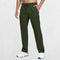 Men's Lightweight Quick-Dry Hiking Trousers in green, featuring a man placing a hand in the trouser pocket, studio shot.