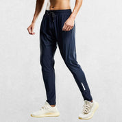 Classic navy blue jogging pants with a relaxed fit and moisture-wicking fabric.