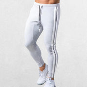 Men’s Striped Joggers in gray color with adjustable drawstring waist, showcasing a sleek and athletic fit.